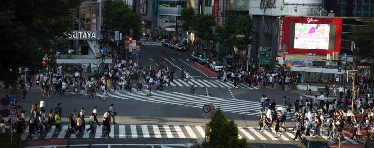 long distance shot of two approaching crowds at shibuya crossing