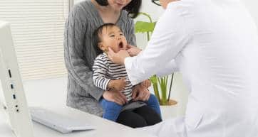Japanese Baby being examined by a doctor