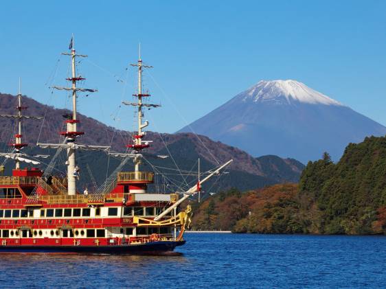 Sightseeing ship at lake Ashi and Mountain Fuji in background