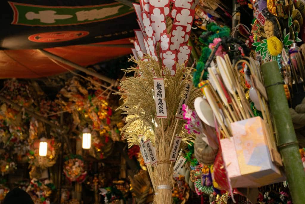 ornamental rakes decorated with lucky charms for sale during the Tori no Ichi (Rooster Market) at Hanazono Shrine in Shinjuku