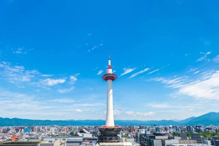 Kyoto Tower against a blue sky