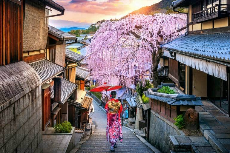 Woman wearing japanese traditional kimono walking at Historic Higashiyama district in spring, Kyoto in Japan