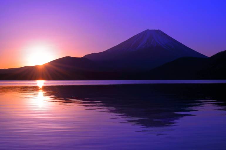 Sunrise over Lake Motosu with Mt. Fuji reflected in the water
