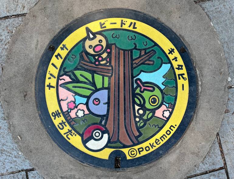Three tree Pokémon manhole cover