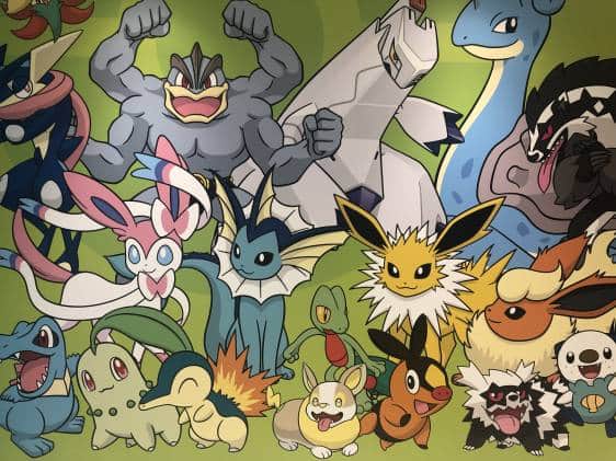 An illustration of Pokemon characters on the wall at the entrance to the Pokemon DX super store in Tokyo