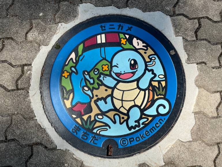 Blue turtle Pokémon manhole cover