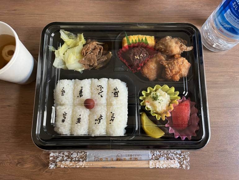 Bento box with rice, meat, and pickles