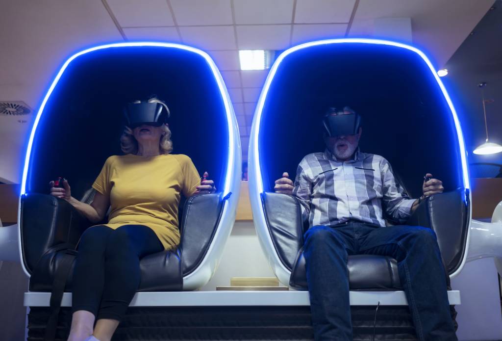 Senior couple in virtual reality simulator